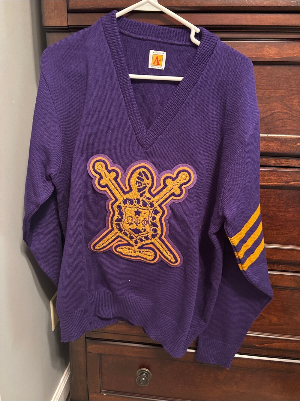 Purple V-Neck Sweater with Gold omega shield Patch and Stripes